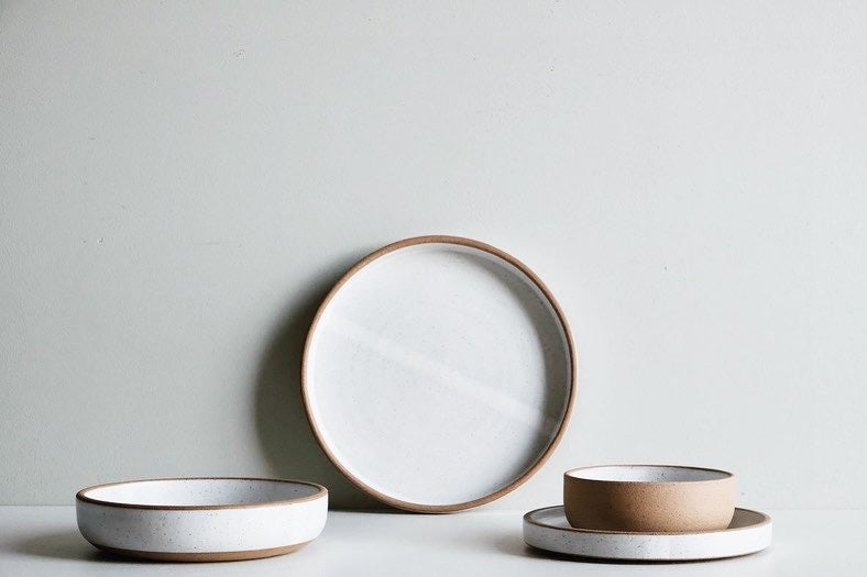 Dinner plate, salad plate, and two sizes of bowl make up a 4 piece place setting.